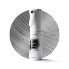 White spray bottle with text on a gray circular background